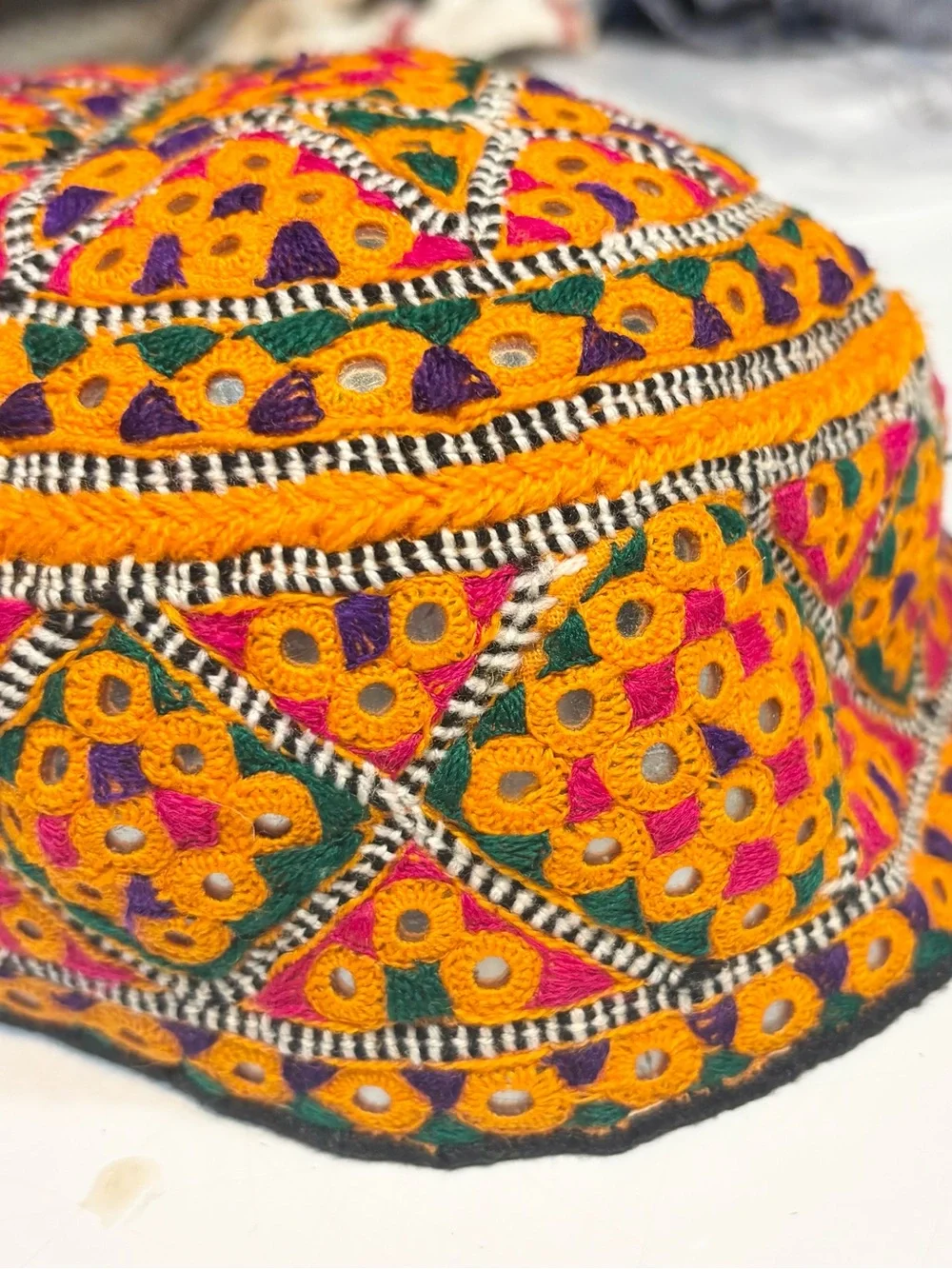 traditional handmade Balochi or Bugti cap featuring vibrant yellow embroidery